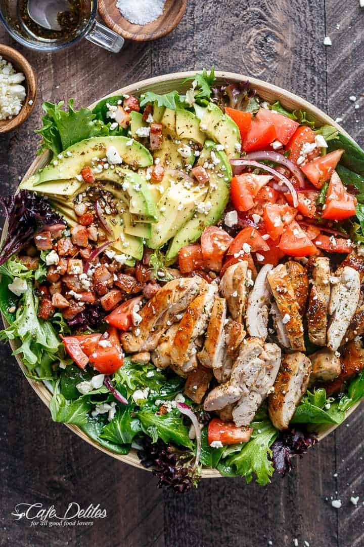 BLT Balsamic Chicken Avocado Feta Salad is a delicious twist to a BLT in a bowl, with a balsamic dressing that doubles as a marinade! You won't even miss the bread in this mega loaded salad. | https://cafedelites.com