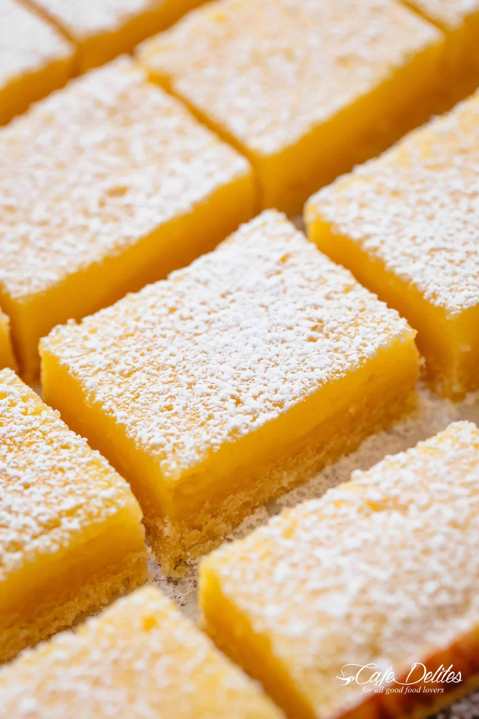 101 calorie Lightened Up Lemon Bars are the perfect dessert and taste so sinful without the guilt! You won't believe they're lightened up! | https://cafedelites.com