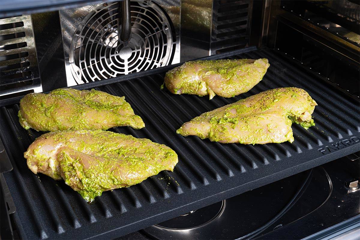 pesto chicken on a grille plate