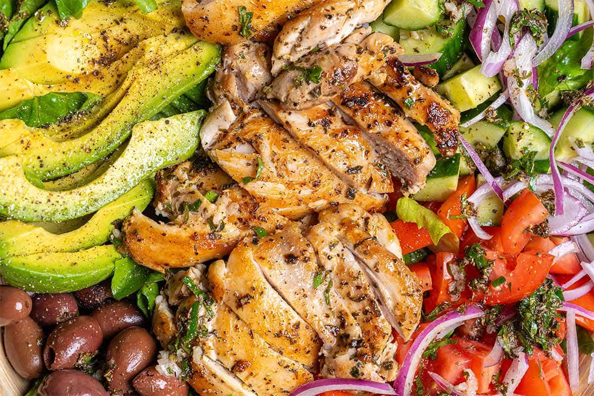close up image of salad combines with chicken and veggies