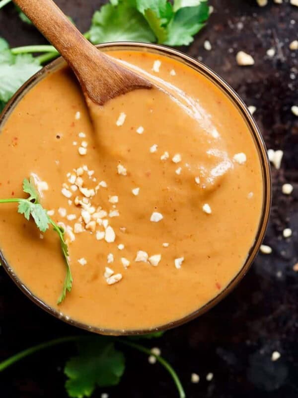 Satay Dipping Sauce with wooden spoon in a bowl