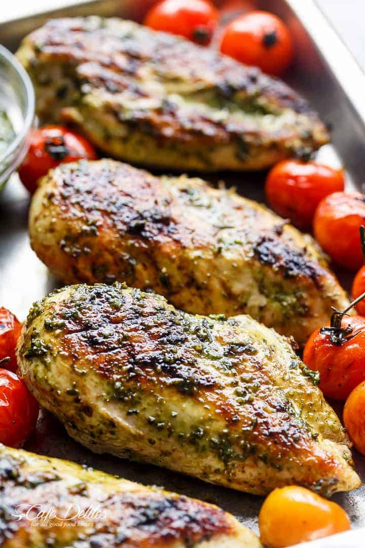 Pesto Chicken GRILLED OR OVEN BAKED, smothered in a creamy, homemade Basil Pesto! Only 2 main ingredients needed, this chicken is out of this world! | https://cafedelites.com