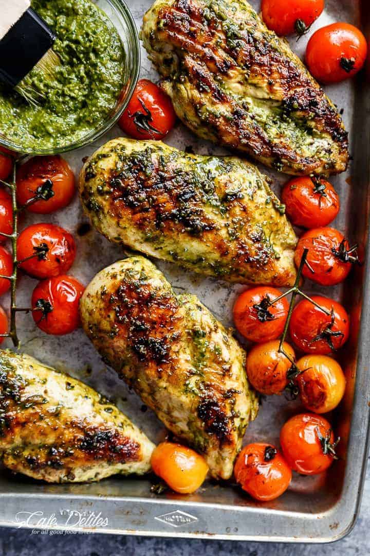 Pesto Chicken GRILLED OR OVEN BAKED, smothered in a creamy, homemade Basil Pesto! Only 2 main ingredients needed, this chicken is out of this world! | https://cafedelites.com