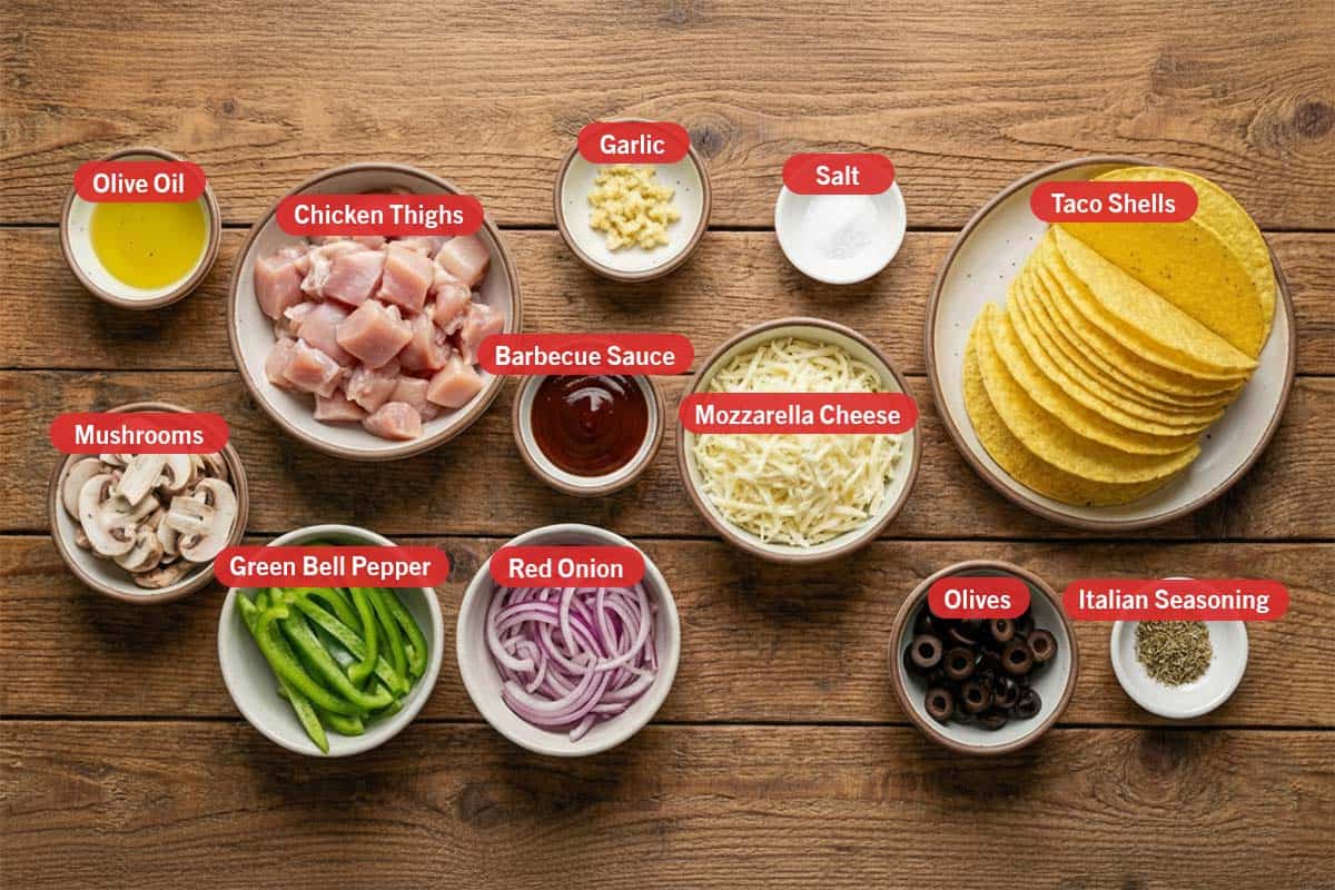 Top shot of ingredients: olive oil, chicken thighs, garlic, salt, taco shells, barbeque sauce, mozzarella cheese, mushrooms, green bell pepper, red onion, olives, and italian seasoning. - 2