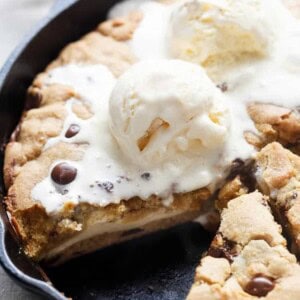 Cheesecake Stuffed Skillet Cookie with ice cream scoop on top