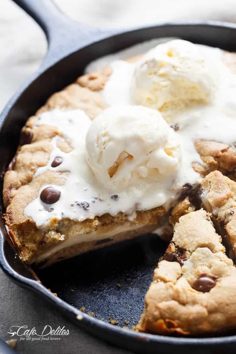 Cheesecake Stuffed Chocolate Chip Skillet Cookie | https://cafedelites.com