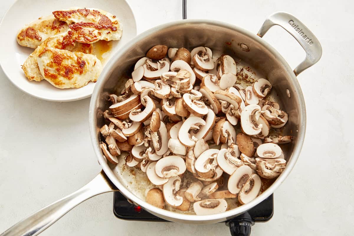 Sauté mushrooms in olive oil until golden, then transfer to a plate.