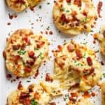 Crispy and Loaded Cheesy Bacon Smashed Potatoes with Chives and an Avocado Crema Cheesy Bacon Smashed Potatoes