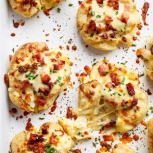Cheesy Bacon Smashed Potatoes on a baking tray
