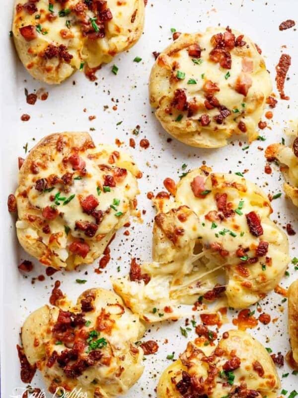 Cheesy Bacon Smashed Potatoes on a baking tray