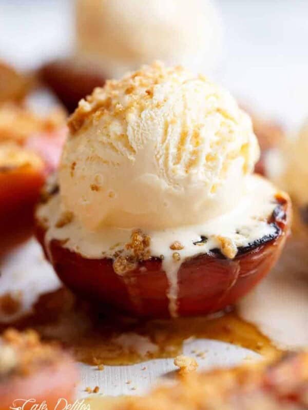Maple Grilled Peaches with a buttery almond cookie crumb! Caramelised with maple syrup, these grilled peaches make for a decadent and healthier dessert!