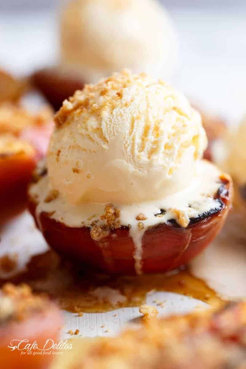 Maple Grilled Peaches with a buttery almond cookie crumb! Caramelised with maple syrup, these grilled peaches make for a decadent and healthier dessert! | https://cafedelites.com