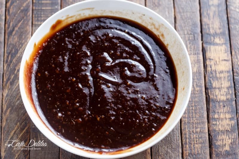 Ramekin of dark brown sauce. 