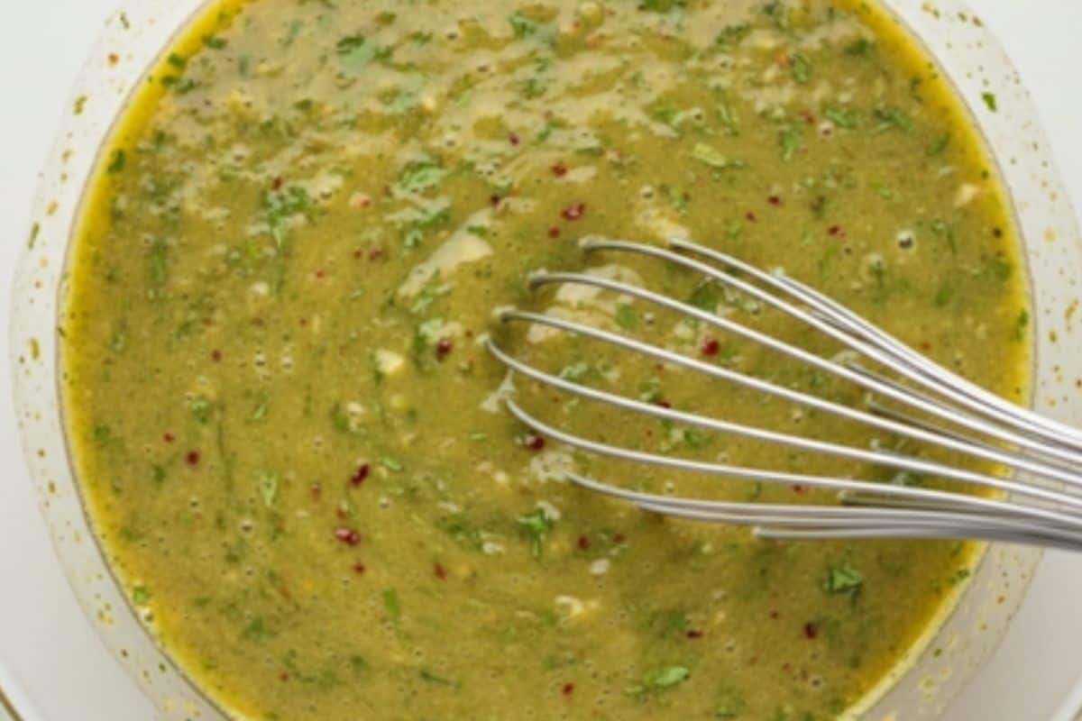 Whisk olive oil, fresh lime juice, crushed garlic, brown sugar, red chili flakes, brown sugar, red chili flakes, ground cumin, salt in a bowl