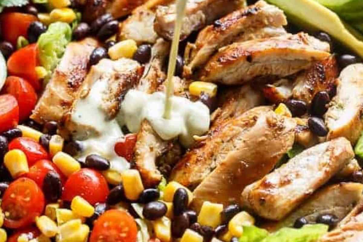 Drizzle the creamy chili lime dressing generously over the top and add the sliced chicken on top.