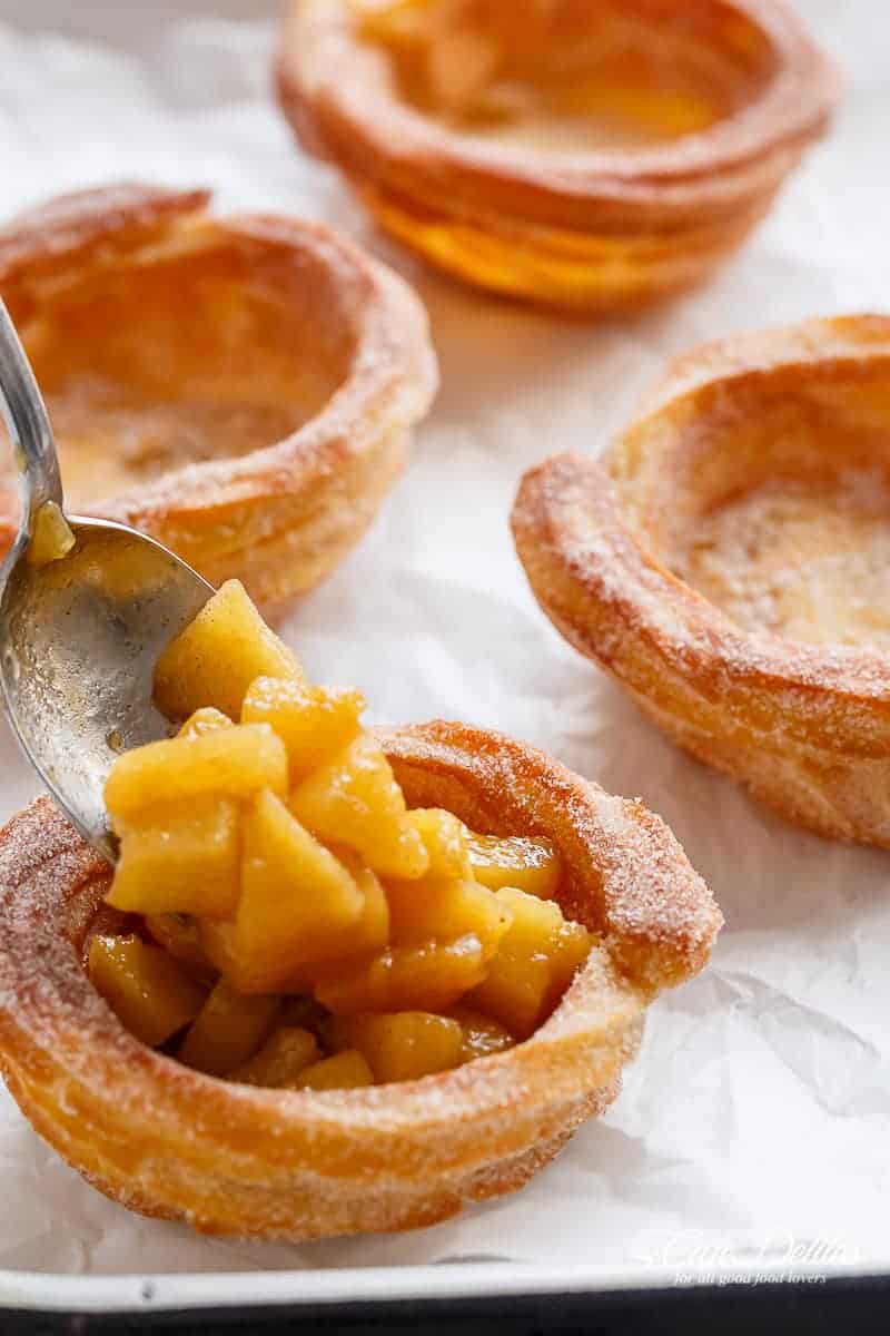 The ultimate pie! CHURRO Apple Pies: where TWO desserts become one! Apple pie filling is served in Churro bowls instead of the traditional pie pastry, and drizzled with an easy, homemade caramel sauce, to make the most incredible dessert! | https://cafedelites.com