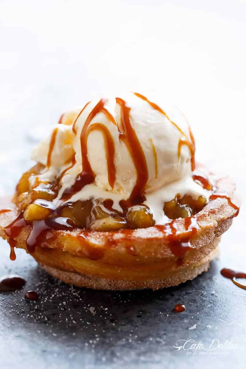 The ultimate pie! CHURRO Apple Pies: where TWO desserts become one! Apple pie filling is served in Churro bowls instead of the traditional pie pastry, and drizzled with an easy, homemade caramel sauce, to make the most incredible dessert! | https://cafedelites.com