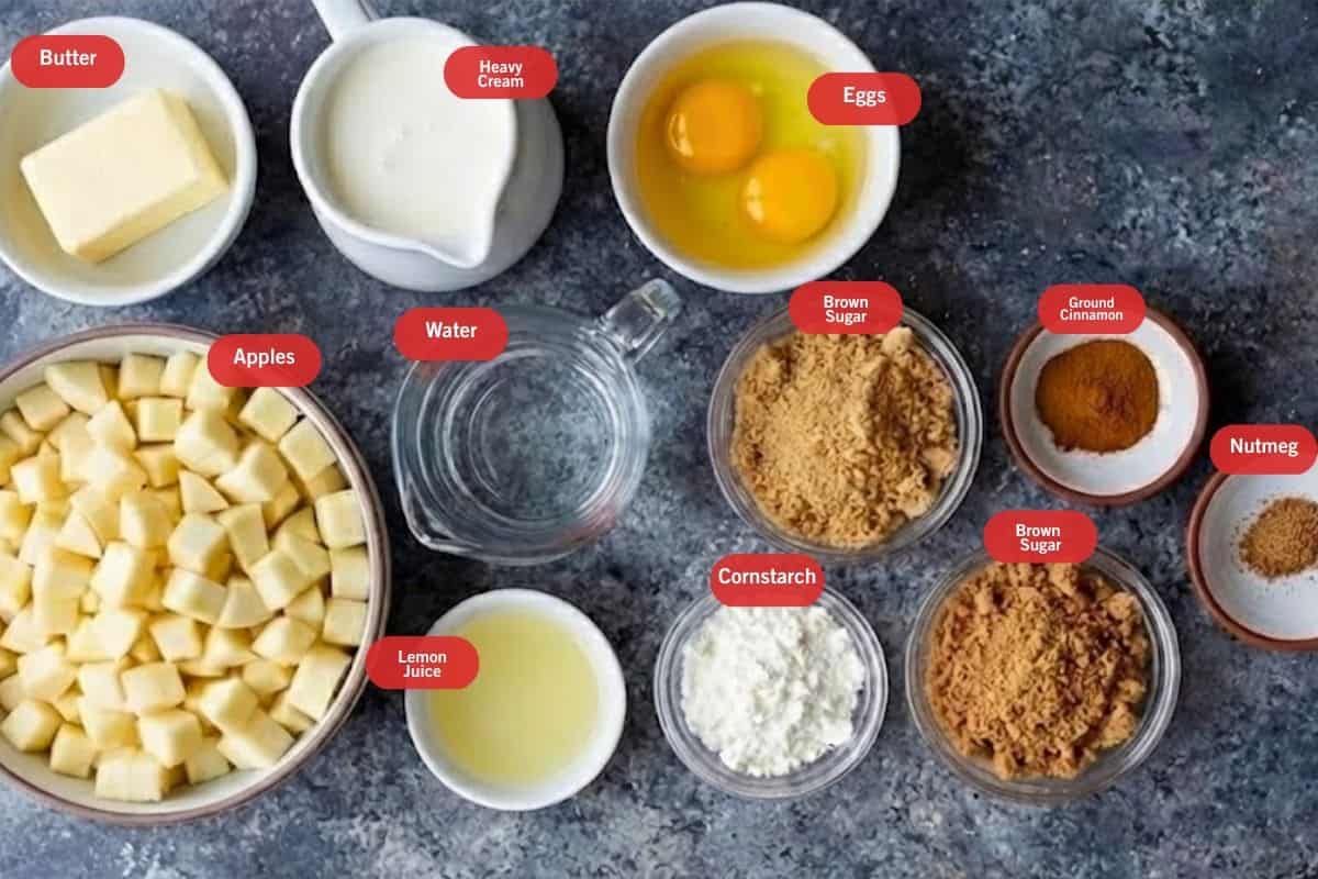 Flat lay photo of ingredient shot of butter, heavy cream ,eggs, apples, lemon juice, brown sugar, cornstarch, ground cinnamon, nutmeg, water - 2