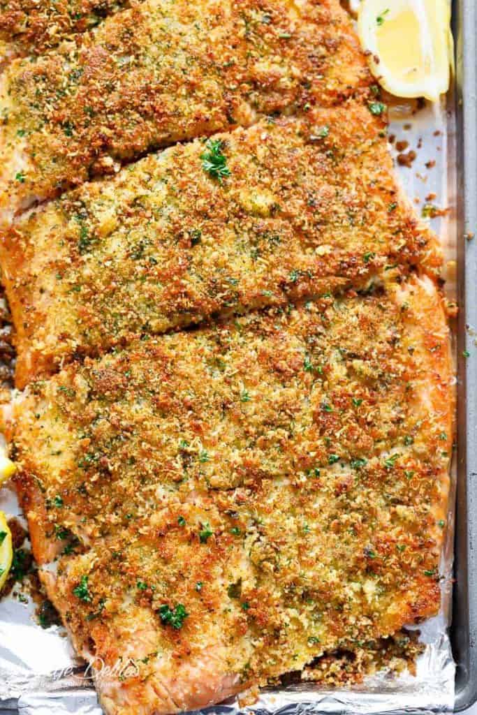 Crispy Garlic Parmesan Salmon is ready and 0n your table in less than 15 minutes, with a 5-ingredient crispy top! Restaurant quality salmon right at home! | https://cafedelites.com