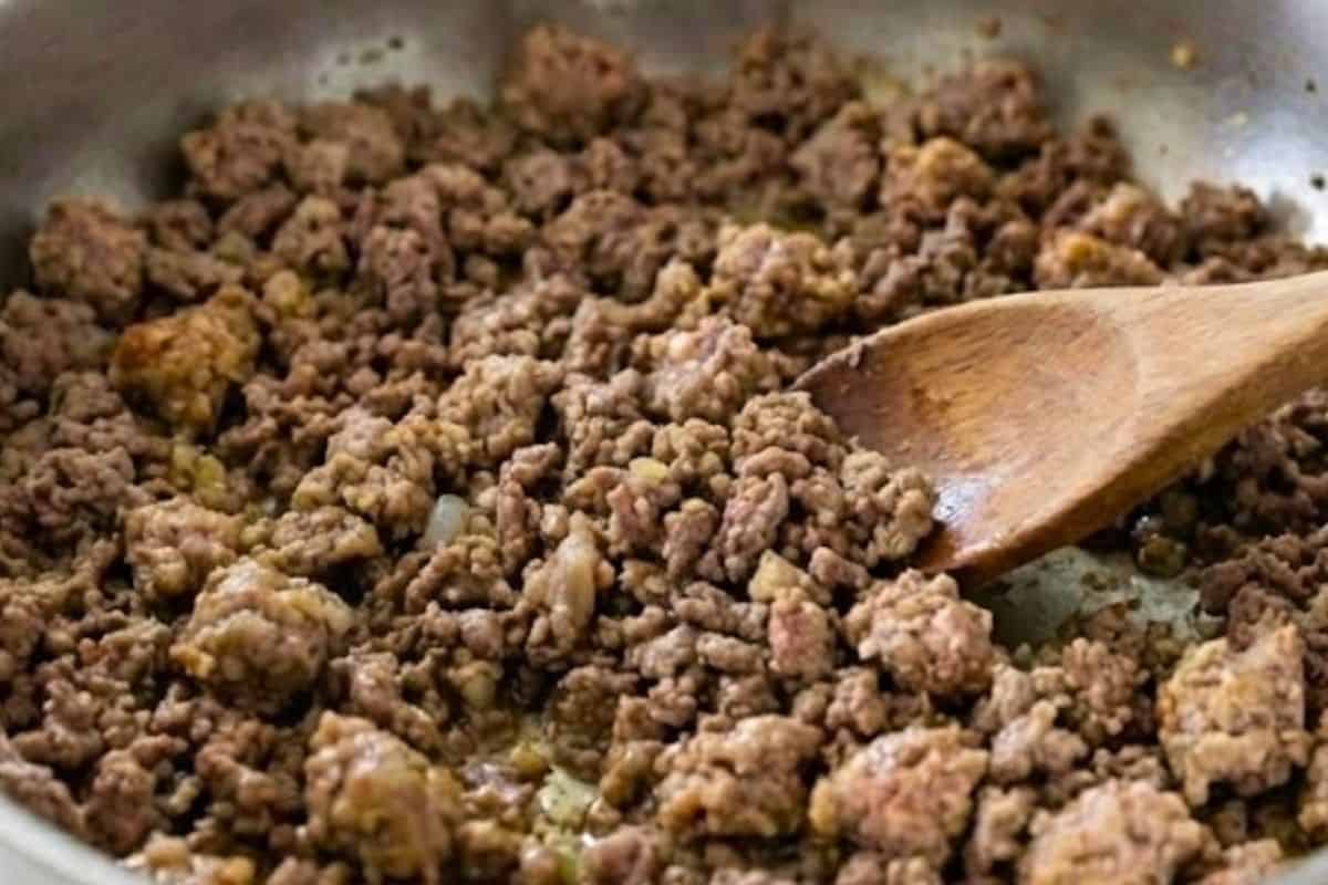 Add the ground beef and sausage, breaking it apart with a wooden spoon - 5