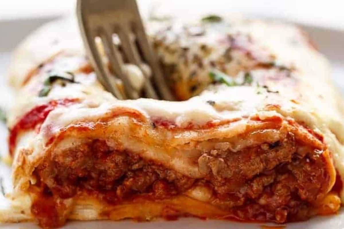 Place the burritos on the tray, spoon over remaining sauces, scatter with shredded mozzarella, then grill until golden - 10