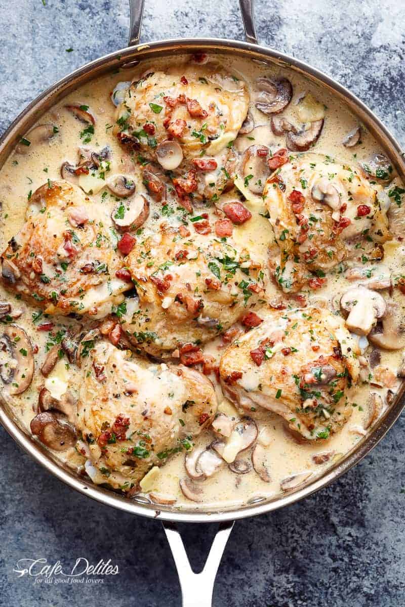 Crispy Baked Chicken Thighs in a mushroom and bacon cream sauce | cafedelites.com