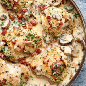 Creamy Baked Chicken Thighs with Mushrooms & Bacon in a platter
