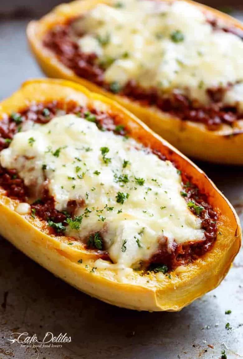Spaghetti Squash Lasagna Boats are an easy, low carb answer to lasagna! With layers of spaghetti squash, bolognese sauce, creamy ricotta and mozzarella! | https://cafedelites.com