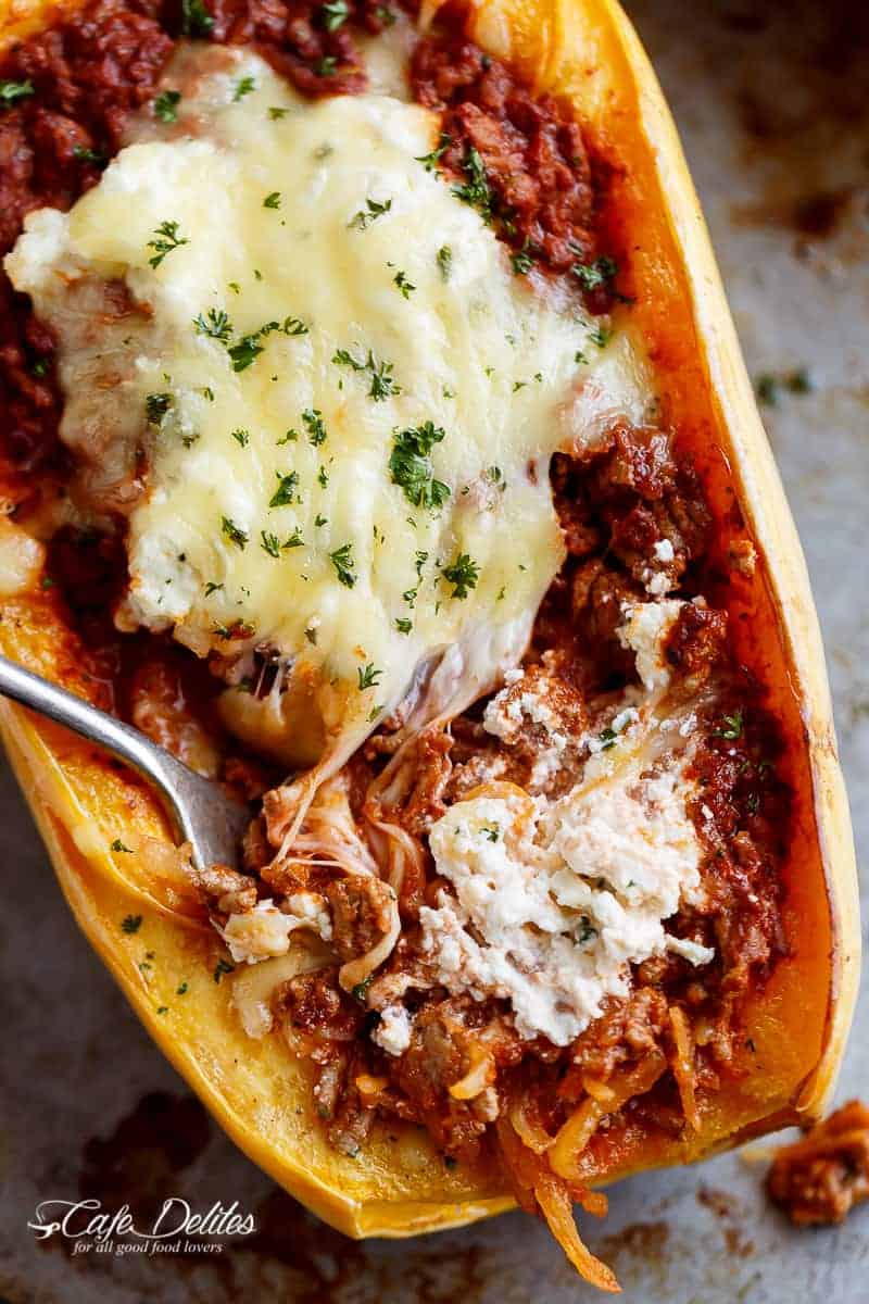 Spaghetti Squash Lasagna Boats are an easy, low carb answer to lasagna! With layers of spaghetti squash, bolognese sauce, creamy ricotta and mozzarella! | https://cafedelites.com