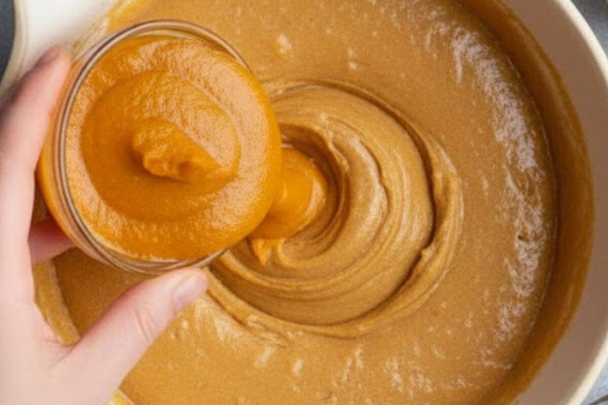 Pour in the eggs, pumpkin purée, melted butter, milk, and vanilla.