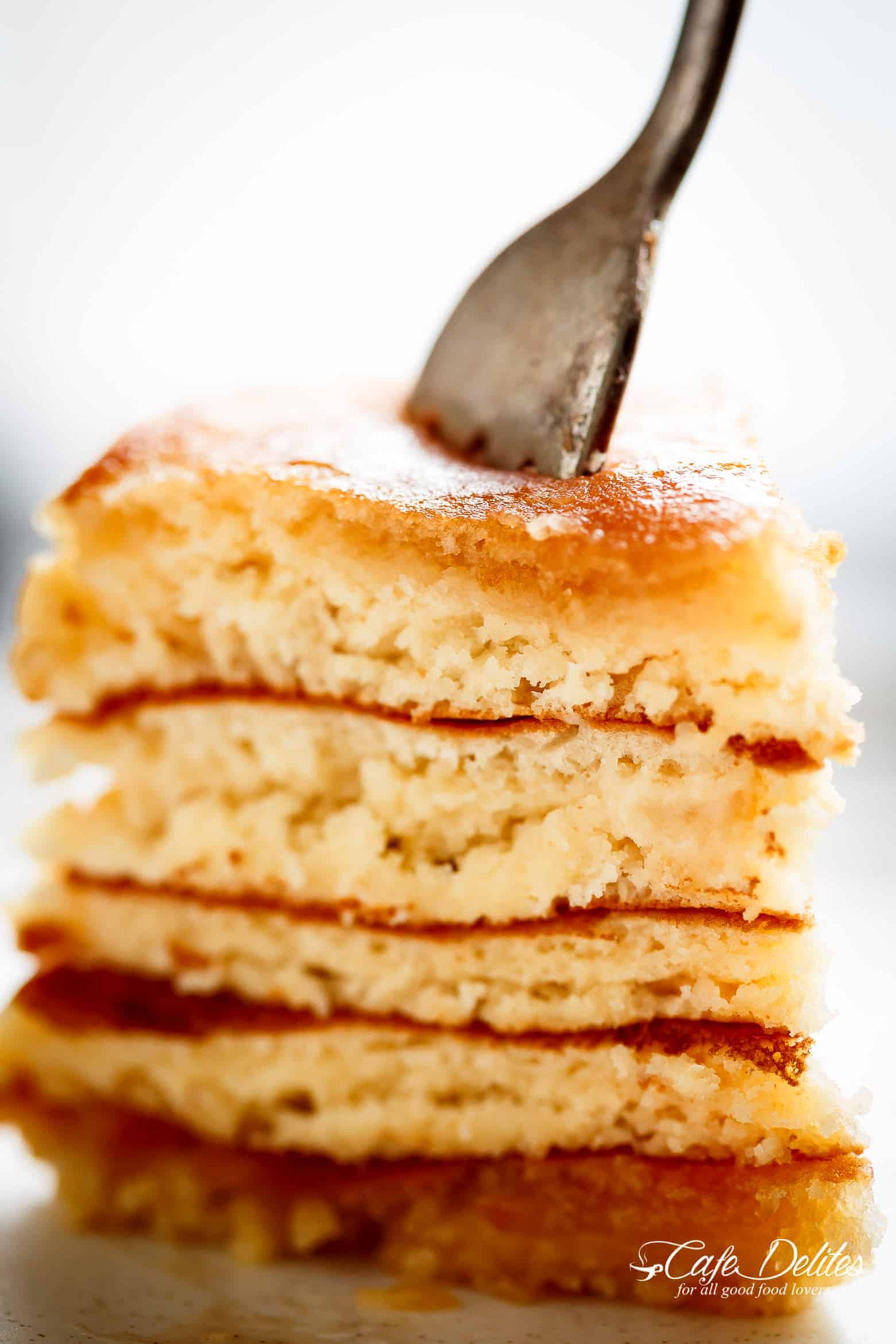 Look no further because a steaming stack of perfectly soft, Best Fluffy Pancakes are right here! Weekends will never be the same again! | https://cafedelites.com