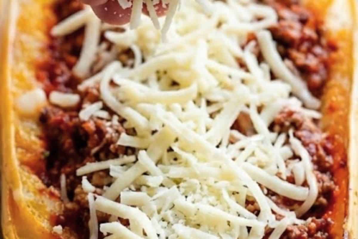 Spoon sauce mixture into the squash boats, then sprinkle parmesan and mozzarella  - 9