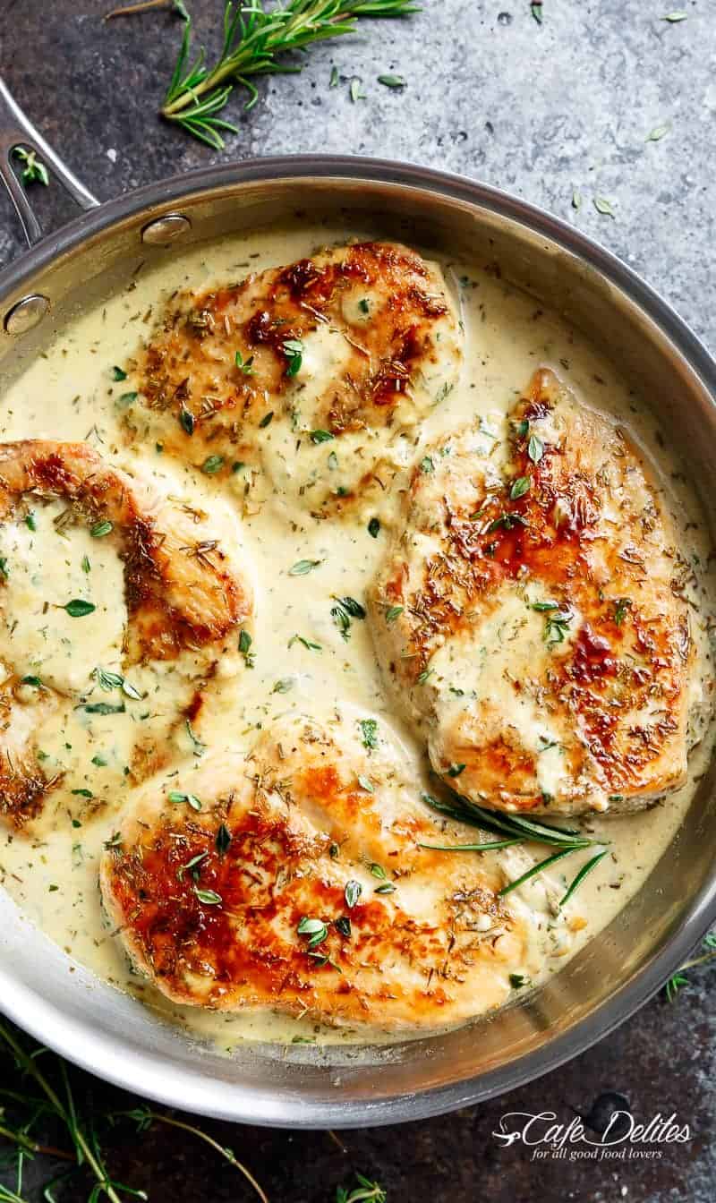 Top view image of creamy chicken with herbs in a delicious, velvety sauce.
