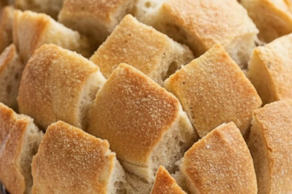 Rotate the loaf and repeat diagonal cuts the other way to form diamond wedges.