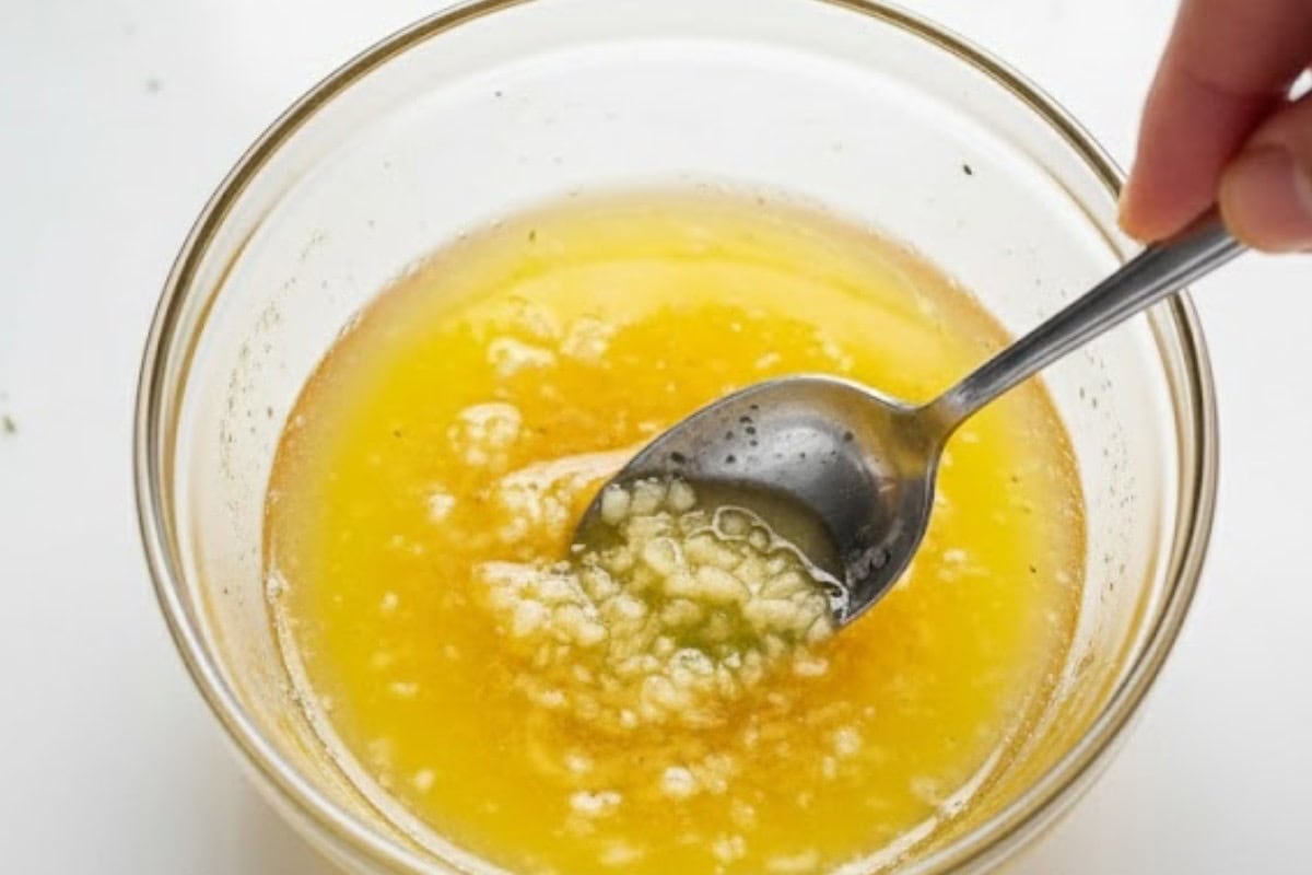 Stir melted butter and crushed garlic in a small bowl until combined.