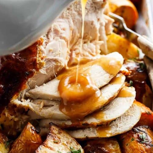 One Pan Juicy Herb Roasted Turkey & Potatoes, with a flavourful gravy made with only 3 ingredients, just in time for Thanksgiving menu planning!