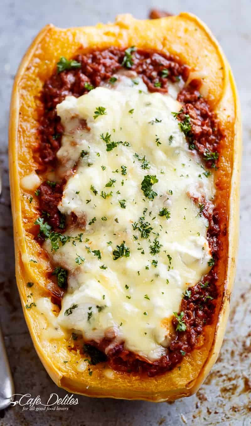 Spaghetti Squash Lasagna Boats are an easy, low carb answer to lasagna! With layers of spaghetti squash, bolognese sauce, creamy ricotta and mozzarella! | https://cafedelites.com