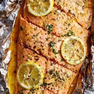 Lemon Butter Garlic Salmon with lemon slices on a foil