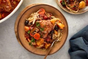 Slow cooker chicken cacciatore served with spaghetti