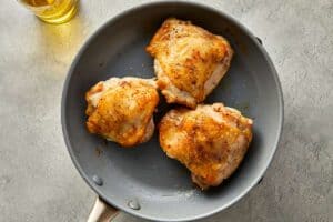 chicken thighs in a nonstick skillet