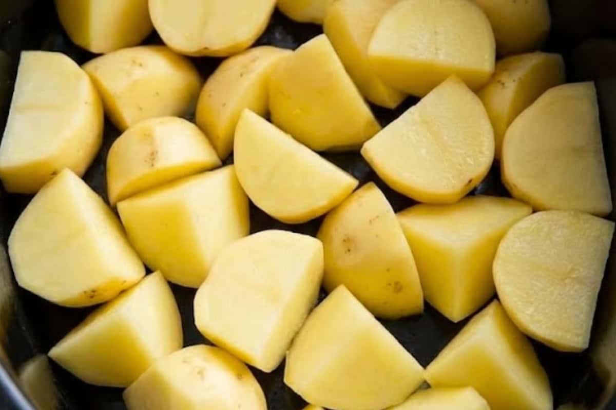 Arrange the potatoes in a single layer in the base of a 6-quart slow cooker