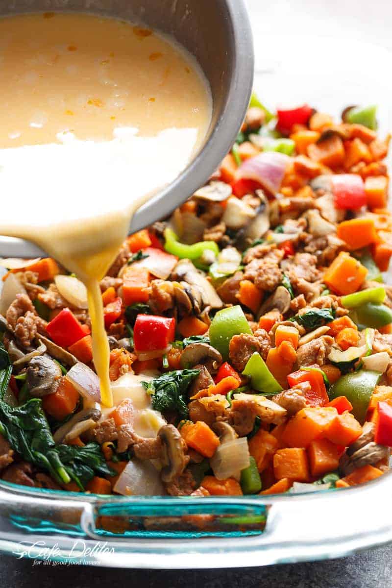 Dressing pouring on Sweet Potato Hash Brown Breakfast Casserole 