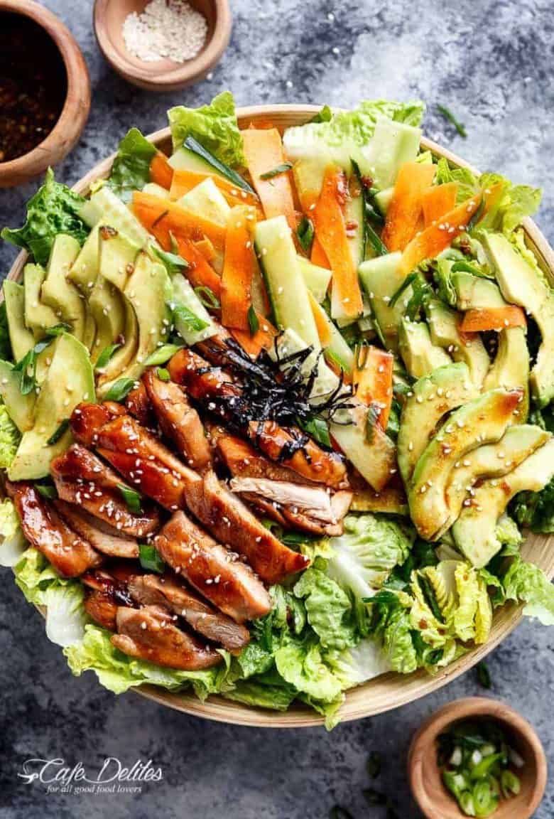 Teriyaki Glazed Chicken Salad complete with avocado, cucumbers, carrots and thin strips of seaweed for real sushi lovers! Drizzled with an incredibly easy teriyaki dressing that doubles as a marinade! | https://cafedelites.com