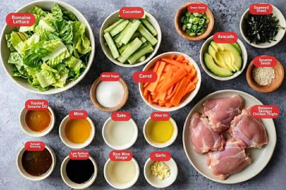 Flat lay photo of ingredient shot of romaine lettuce, cucumber, green onions, seaweed sheet, avocado, sesame seeds, boneless skinless chicken thighs, carrot, white sugar, low sodium soy sauce, mirin, sake, minced garlic, oil, sesame oil, rice wine vinegar, teriyaki dressing, 