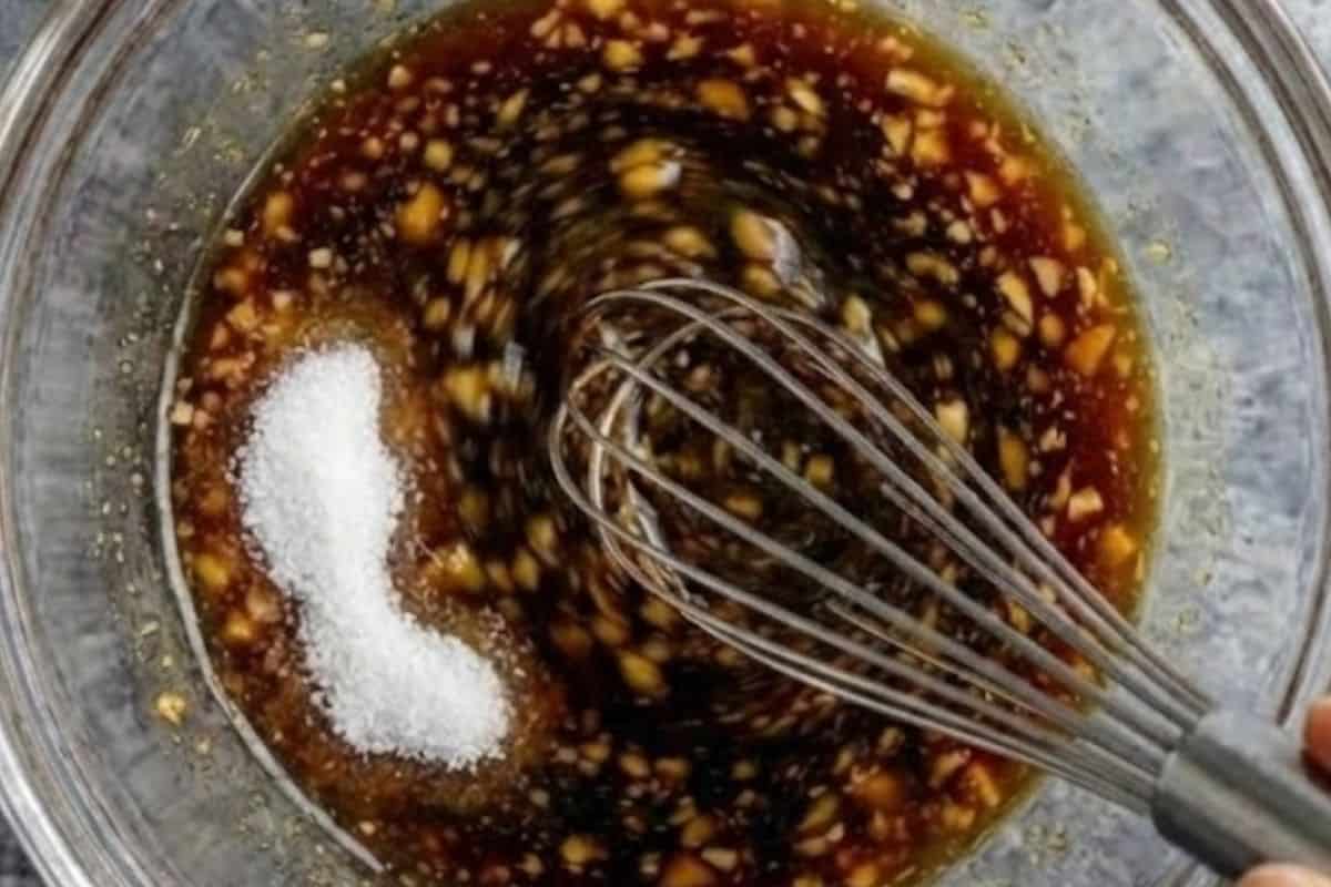 Combine soy sauce, mirin, sake, sugar, and garlic in a bowl.