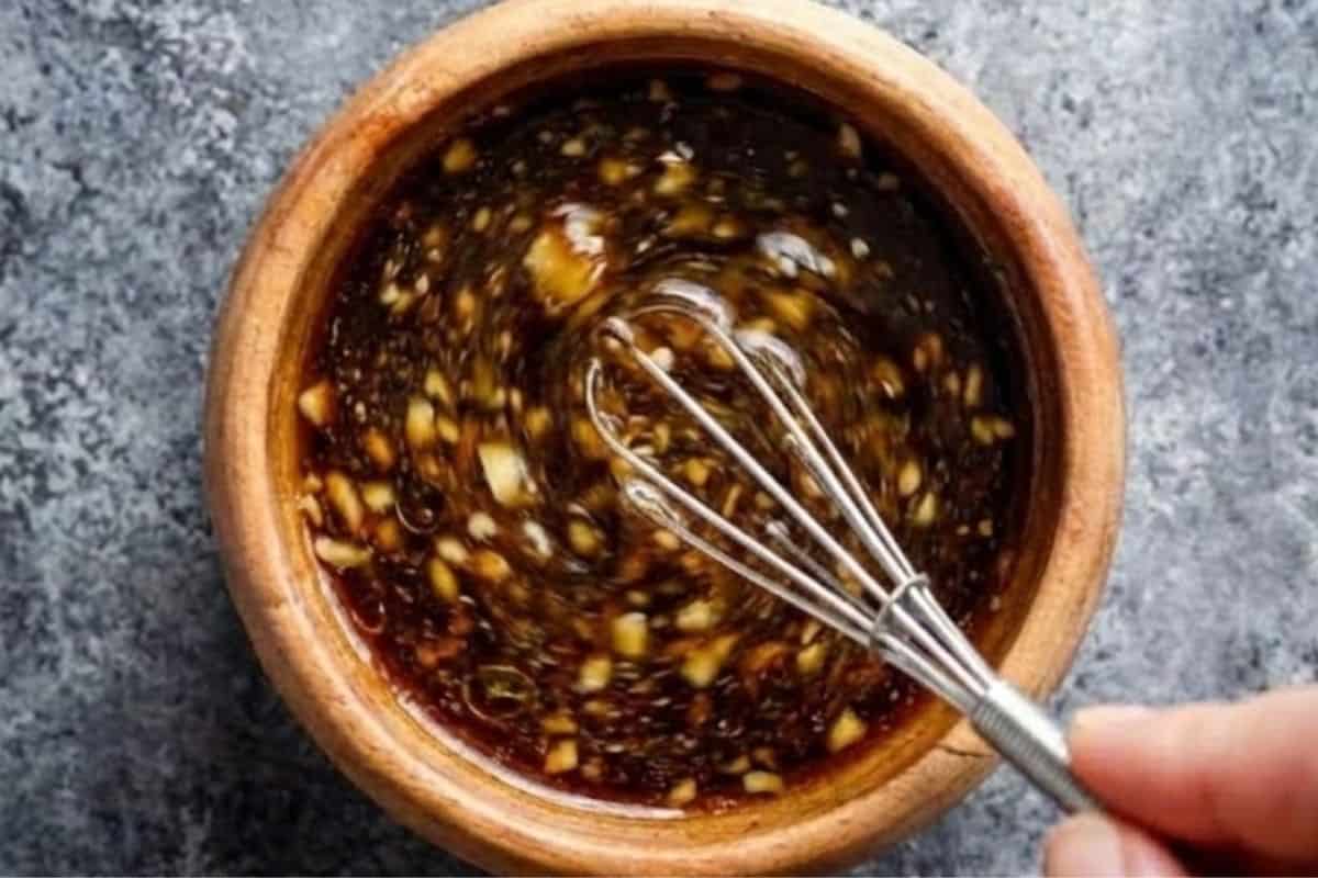 Whisk the reserved marinade with rice wine vinegar and sesame oil, then add a splash of water to loosen it.