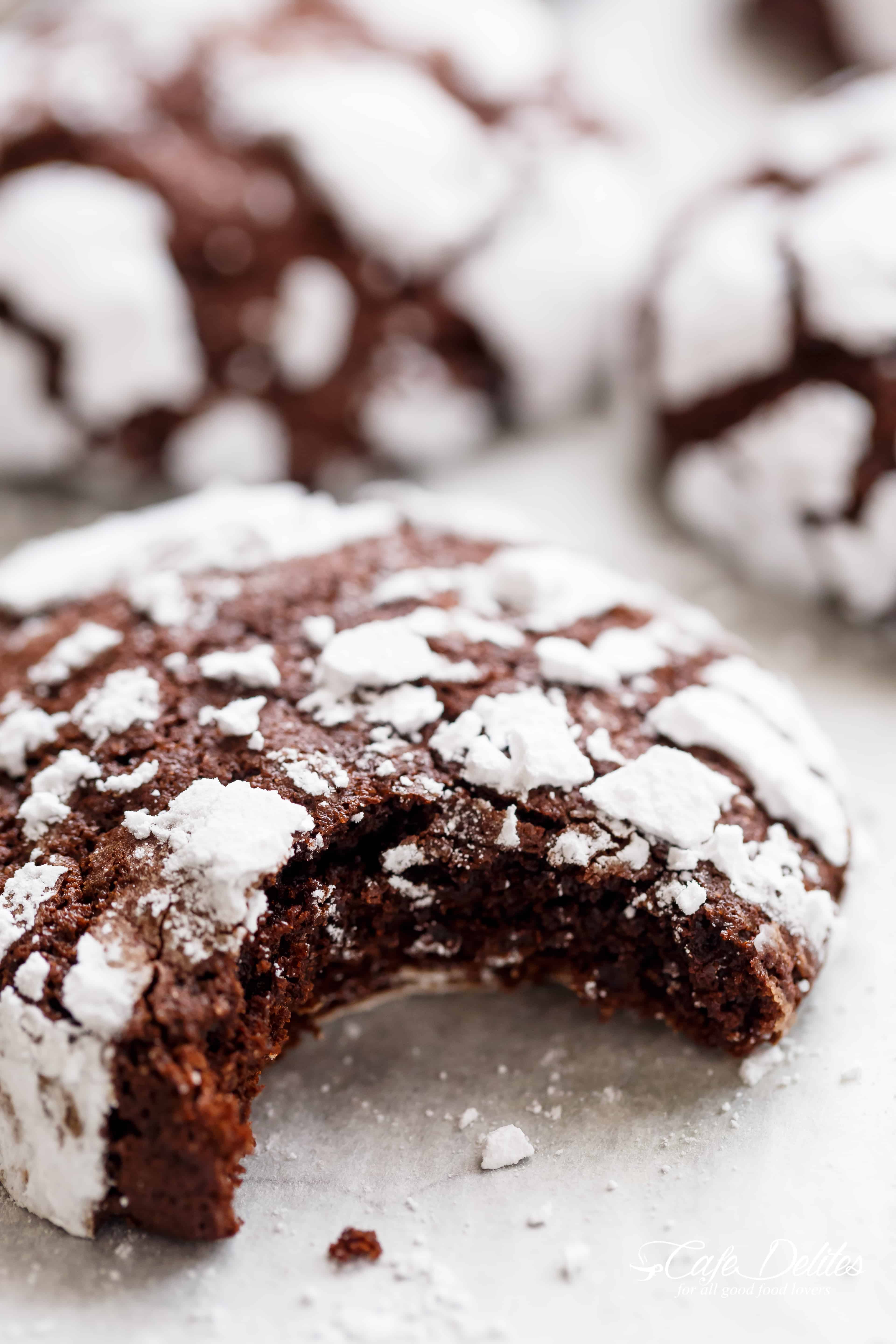 Fudgy Chocolate Crinkle Cookies have an irresistible brownie textured centre, with a crunch of cookie on the outside! One of our favourite Christmas cookies right here! ONLY 88 calories EACH! | https://cafedelites.com