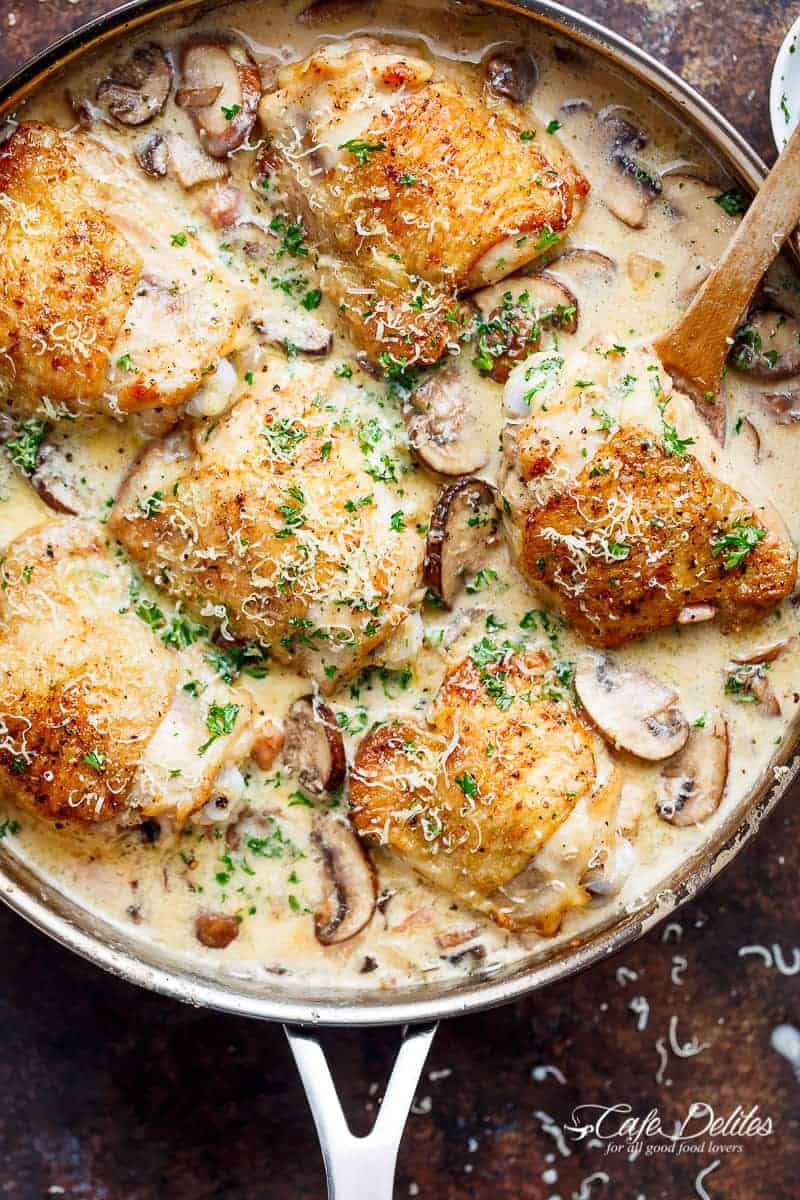 A thick and lightened up Creamy Parmesan Herb Chicken Mushroom with a kick of garlic is your new favourite dinner recipe! With NO heavy cream — or ANY cream — at ALL! | https://cafedelites.com