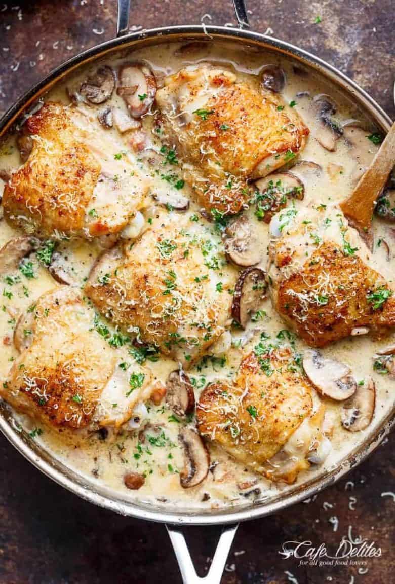 A thick and lightened up Creamy Parmesan Herb Chicken Mushroom with a kick of garlic is your new favourite dinner recipe! With NO heavy cream — or ANY cream — at ALL! | https://cafedelites.com