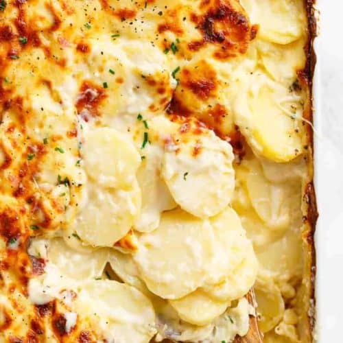 Garlic Parmesan Scalloped Potatoes layered in a creamy garlic sauce with parmesan and mozzarella